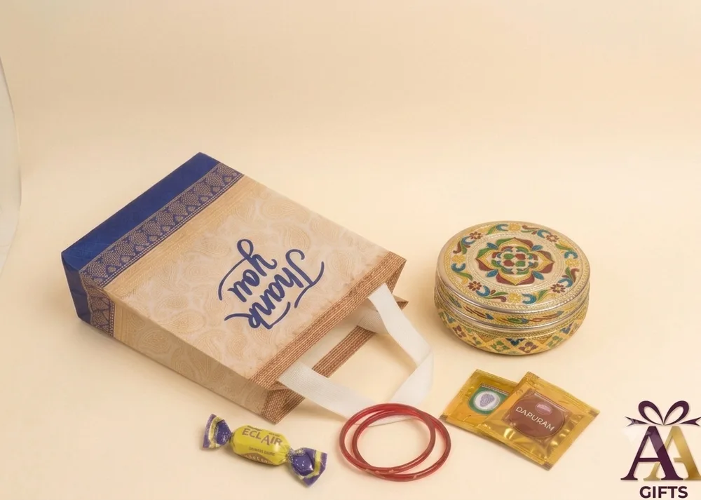 Blue border paisley thank you return gift bag paired with colorful mandala enamel box in Chennai