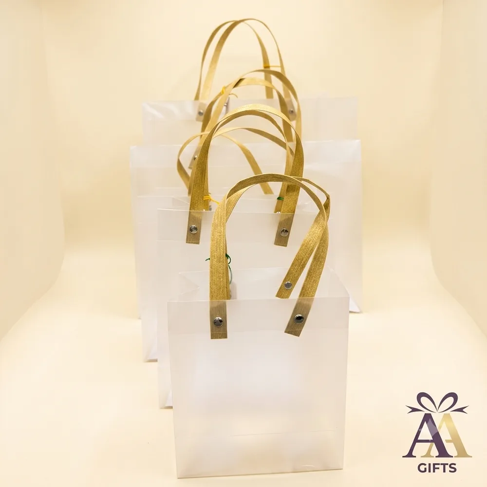 Frosted PVC return gift bags with golden handles set in Chennai wholesale