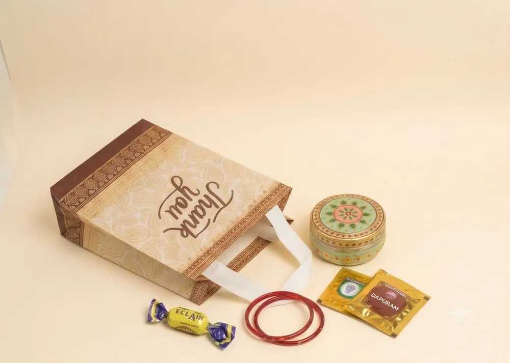 Traditional paisley thank you return gift bag with floral enamel box, bangles, and pooja essentials in Chennai