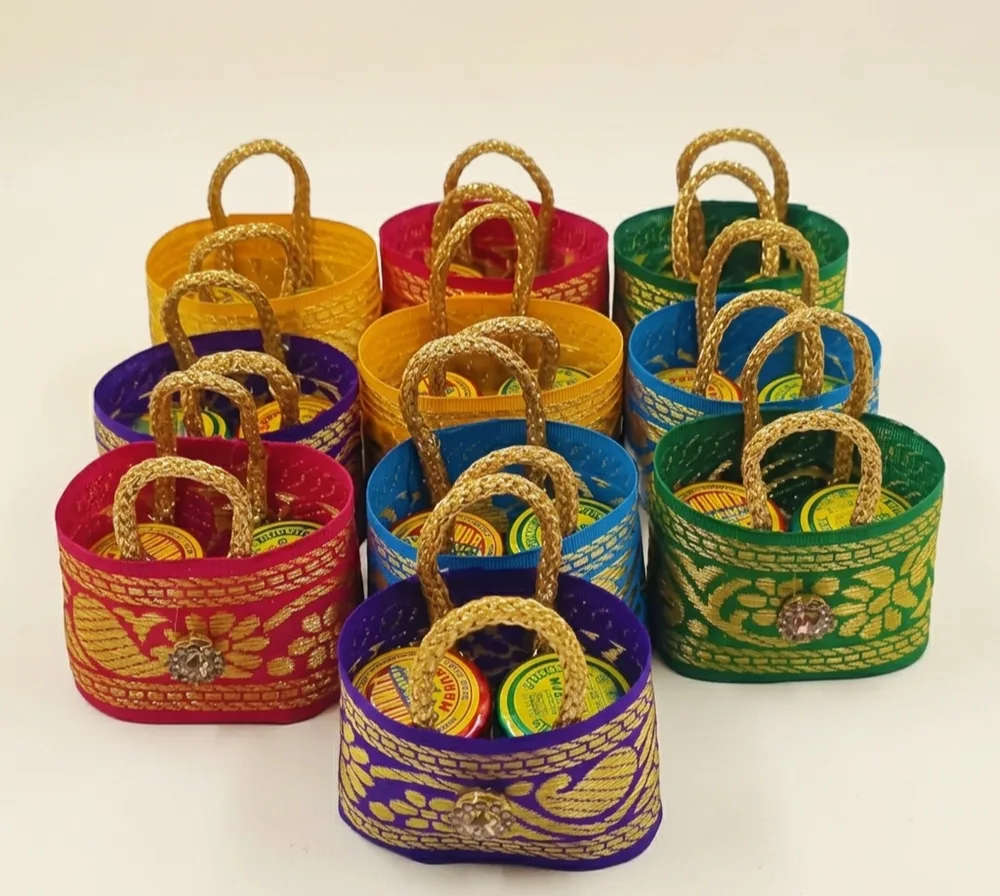 Silk brocade ribbon mini basket bags with haldi kumkum containers thamboolam favors Chennai